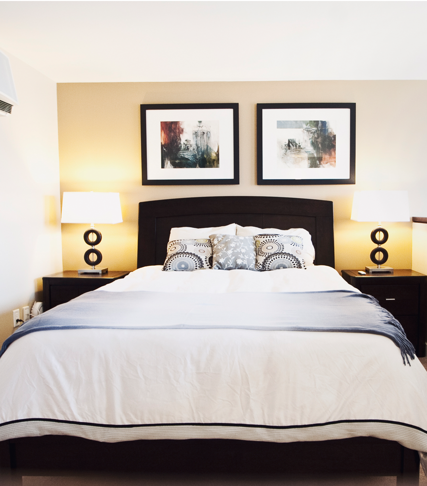 Bedroom with Two Night Tables and Wall Art